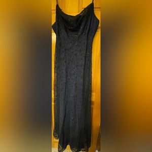 Evening gown. Purple underlined with black velour on top.